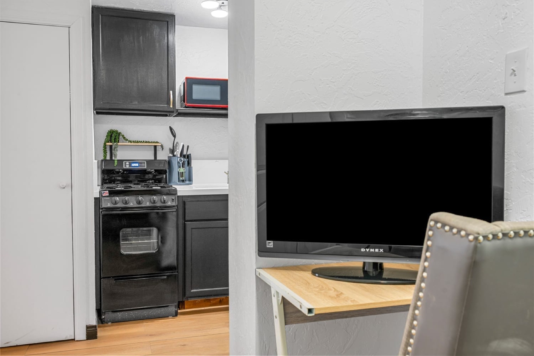 Studio Suite kitchenette and television
